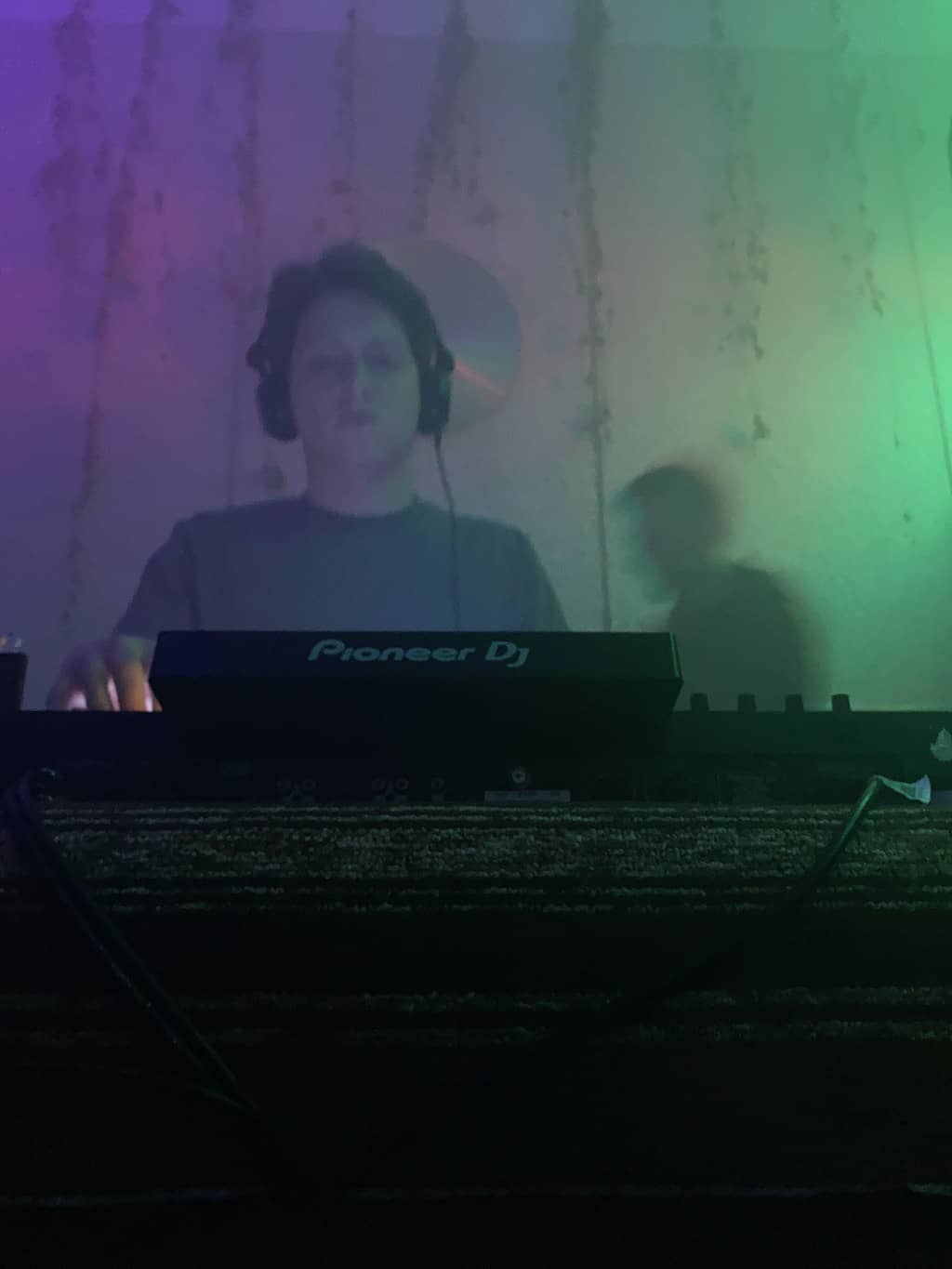Dance Floor Close-up shot of Nerijus behind the decks